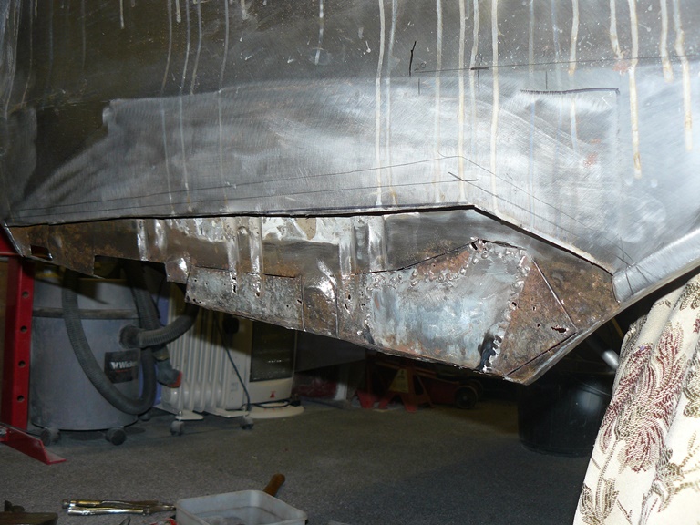 Offside lower quarter. Cutting rust from inner..jpg