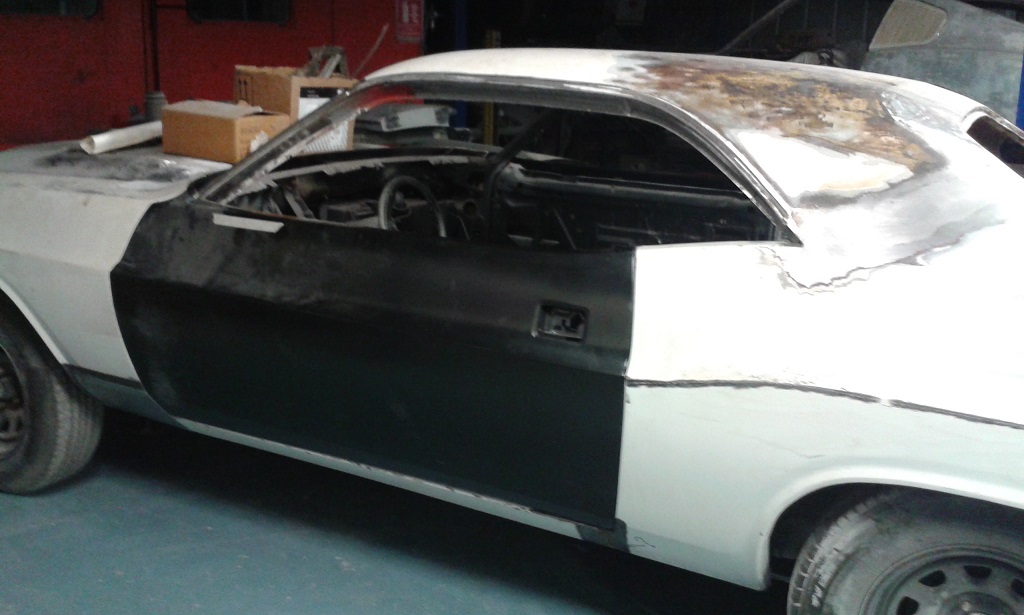 Driver's side (masking tape line is a reminder to transfer mirror mounting holes across from the old skin)